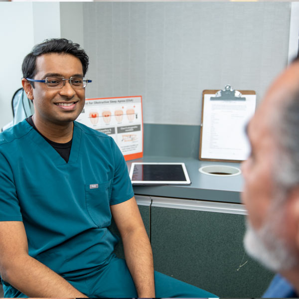 Dr. Gurjar with implant patient