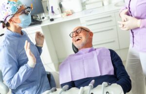 An illustrative graphic showcasing a before-and-after comparison of a patient's smile, highlighting the transformative impact of dental implants. The "before" side shows missing or damaged teeth, while the "after" side displays a complete, natural-looking smile with dental implants. The image contains the text, "Dental Implants: Restore Your Smile and Confidence".